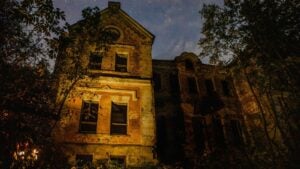 Old brick house at night Canva